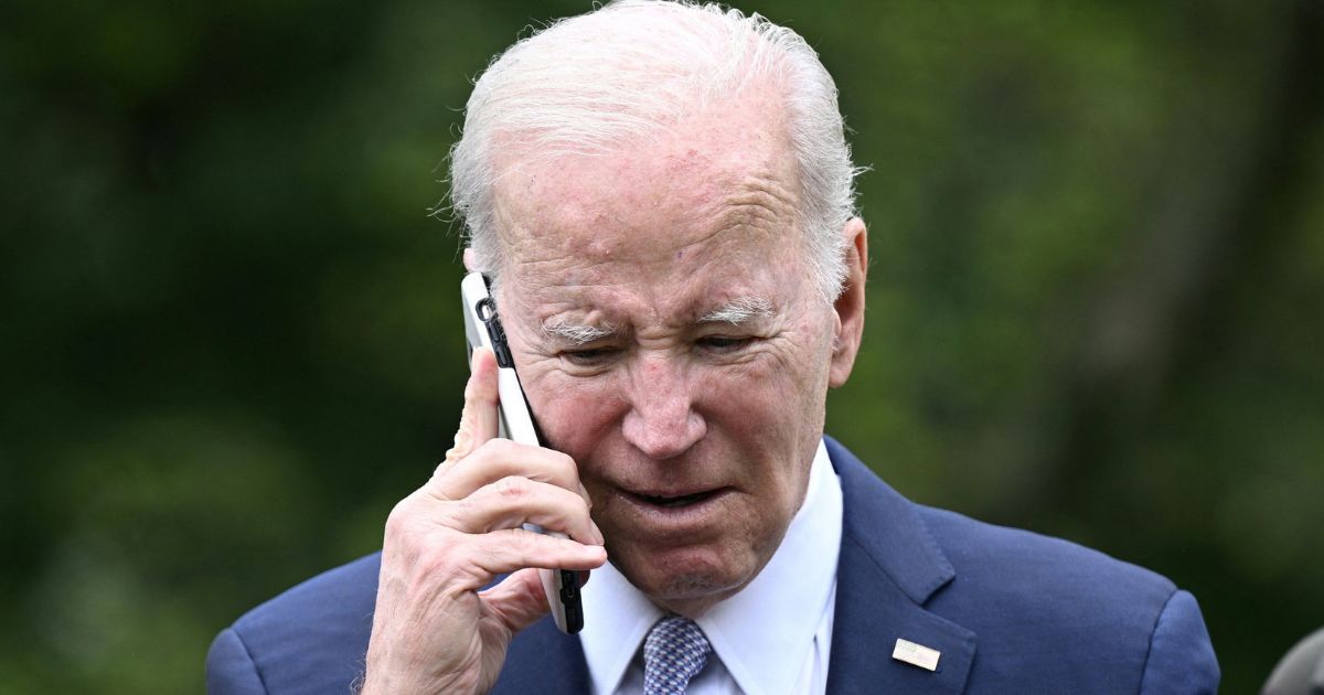 President Joe Biden speaks on the phone during a National Small Business Week event in the Rose Garden of the White House in Washington, D.C., on May 1, 2023.