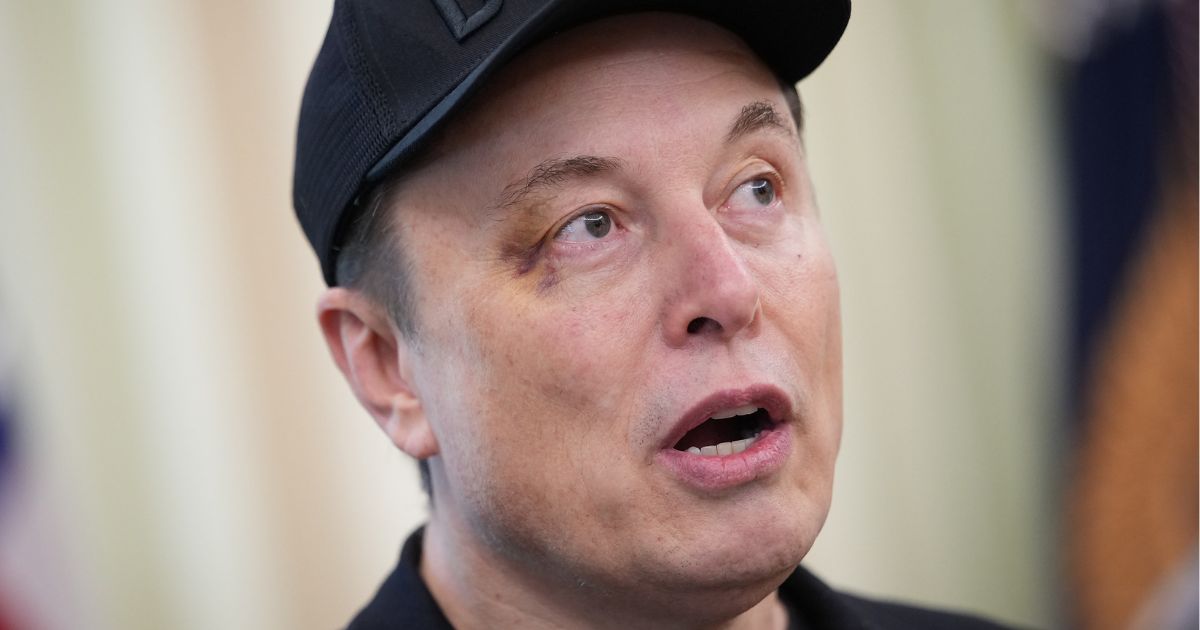 Elon Musk speaks to reporters in the Oval Office at the White House in Washington, D.C., on May 30.