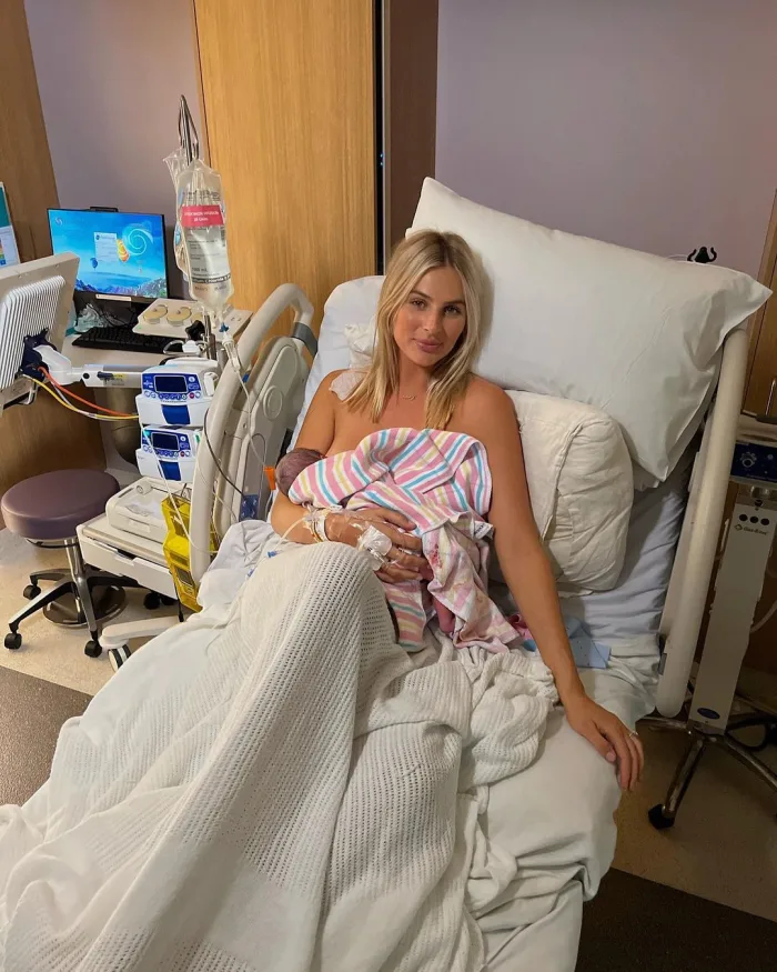 Indy Clinton with her newborn in the hospital
